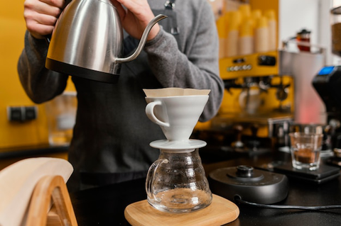 A person pouring coffee